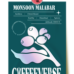 Monsoon Malabar Omni Roast coffee from Thogarihunkal Estate. The packaging is green with an illustration of a coffee bean and text detailing the coffee's characteristics such as 'Earthy', 'Hazelnut', and 'Spices'.